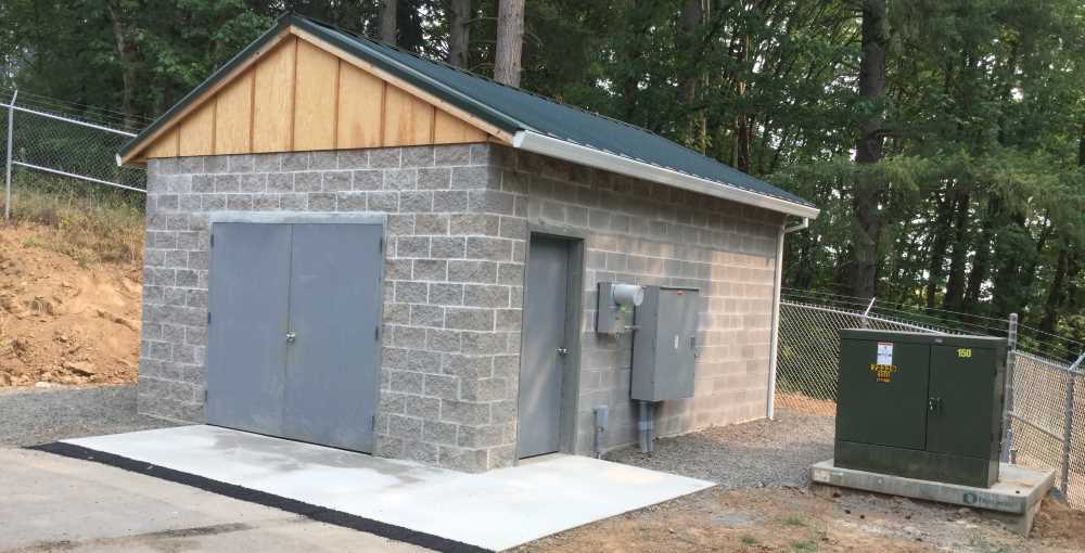 Finished foundation and pump house on a completed building site