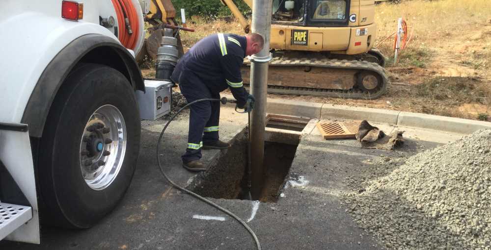 Sewer line installation in an open trench